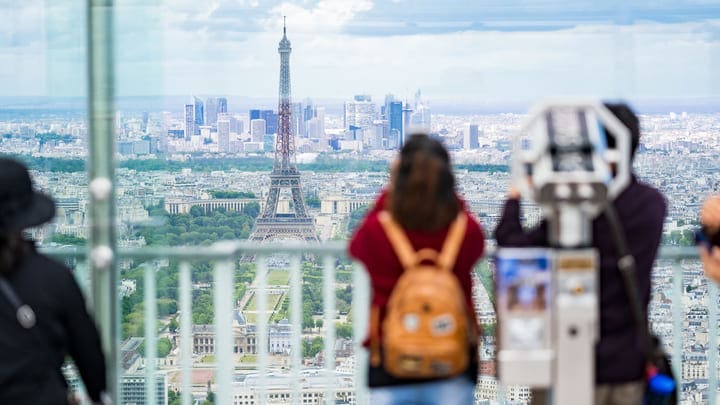 Tourists viewing the Eiffel Tower from Tour Montparnasse