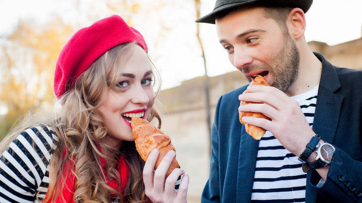 French stereotypes with striped shirts, berets and croissants