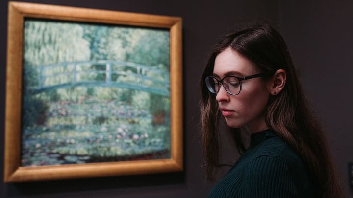 Woman viewing a Monet at Musée d'Orsay